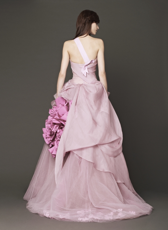 Vera Wang - Fall 2014 Bridal Collection - Wedding Dress Look 2
<br><br>
Petal strapless silk organza ball gown with hand draped bodice accented by organic flower, grosgrain shoulder strap and peony faille blossom.

<br><br>